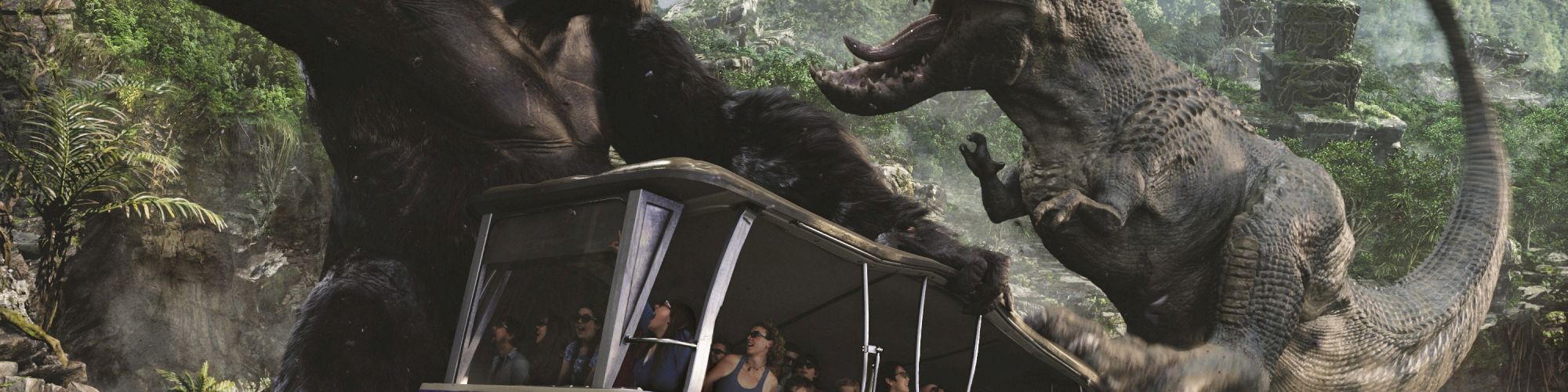 A tram filled with passengers is surrounded by a giant gorilla and a dinosaur engaged in a battle in a jungle-like setting.